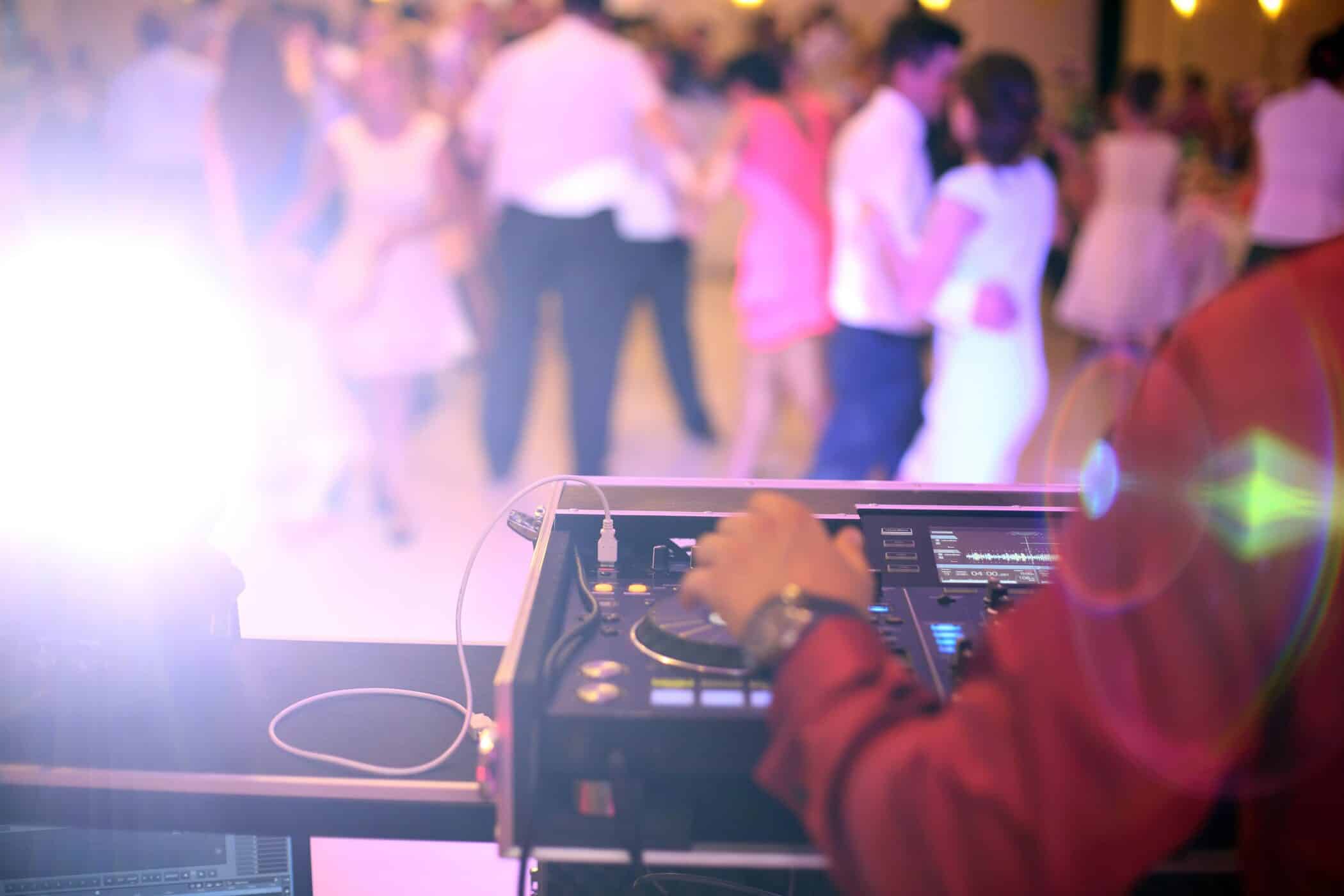 A Wedding DJ playing Live Music at A Wedding Reception.