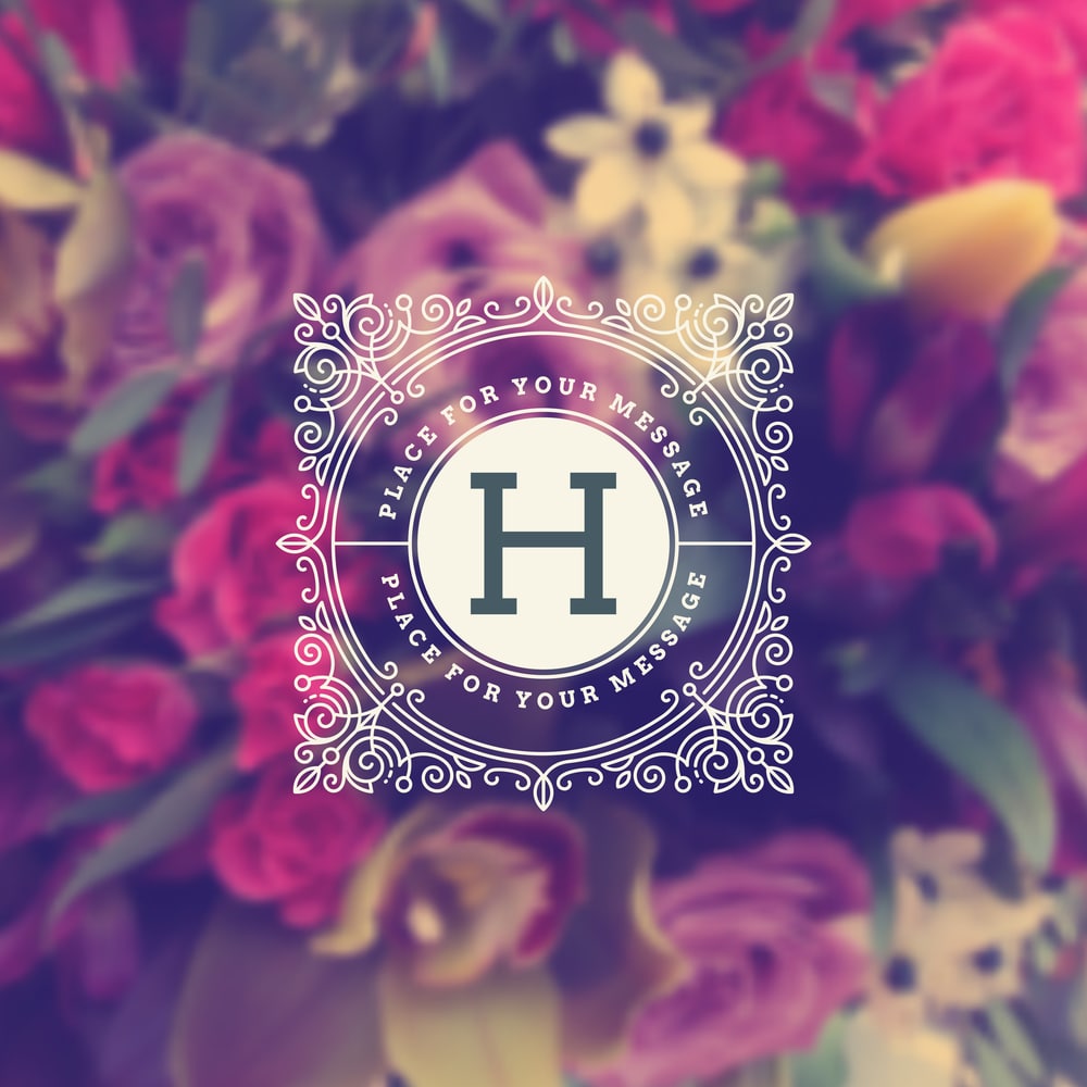 Wedding monogram design with letter 'H' over floral background